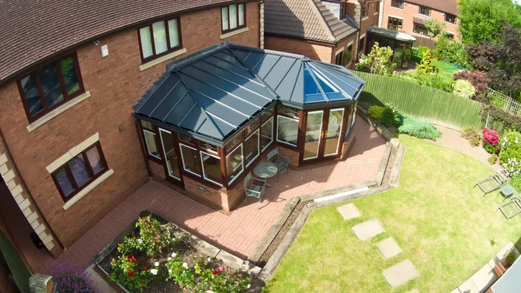 brown wood conservatroy with grey roof