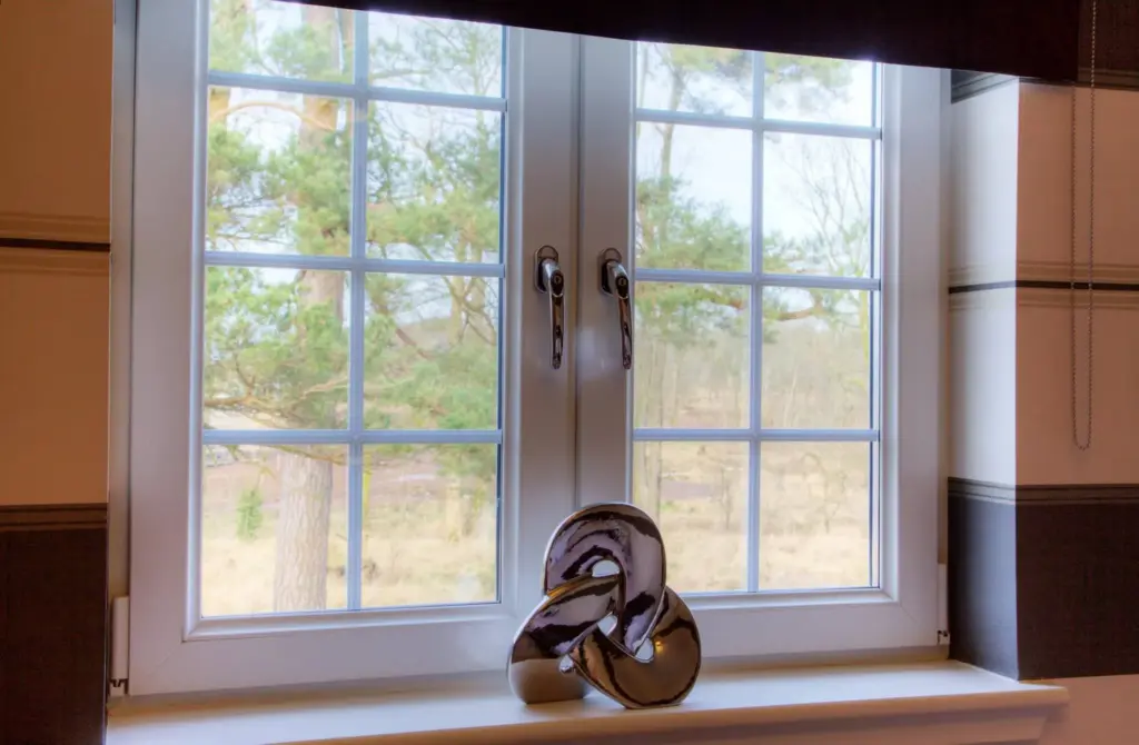 casement windows with golden handles inside view