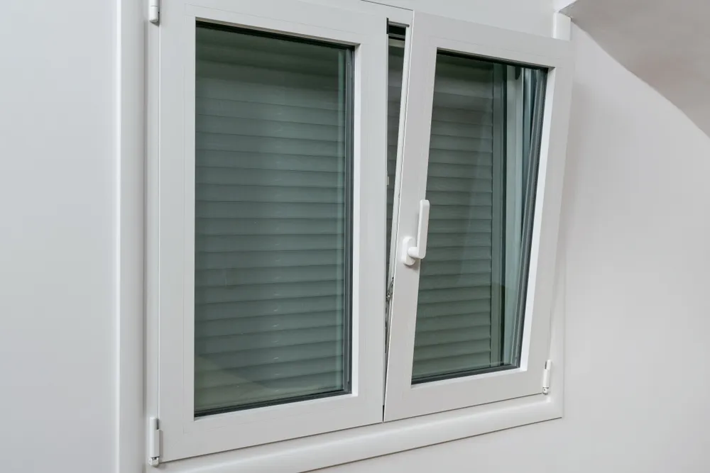 white upvc tilt and turn window in tilt position inside view